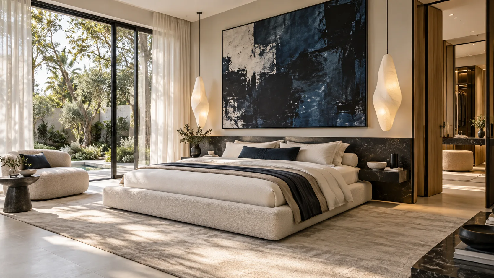 Principal bedroom with upholstered bed wall, bedside lighting and seating