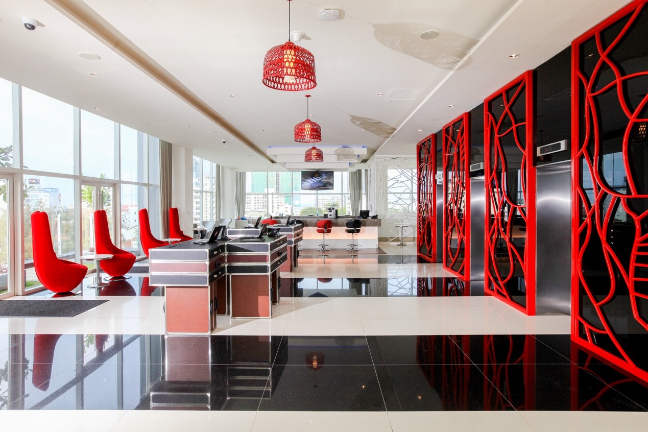 Urban hotel lobby with bold colour and sculptural lighting