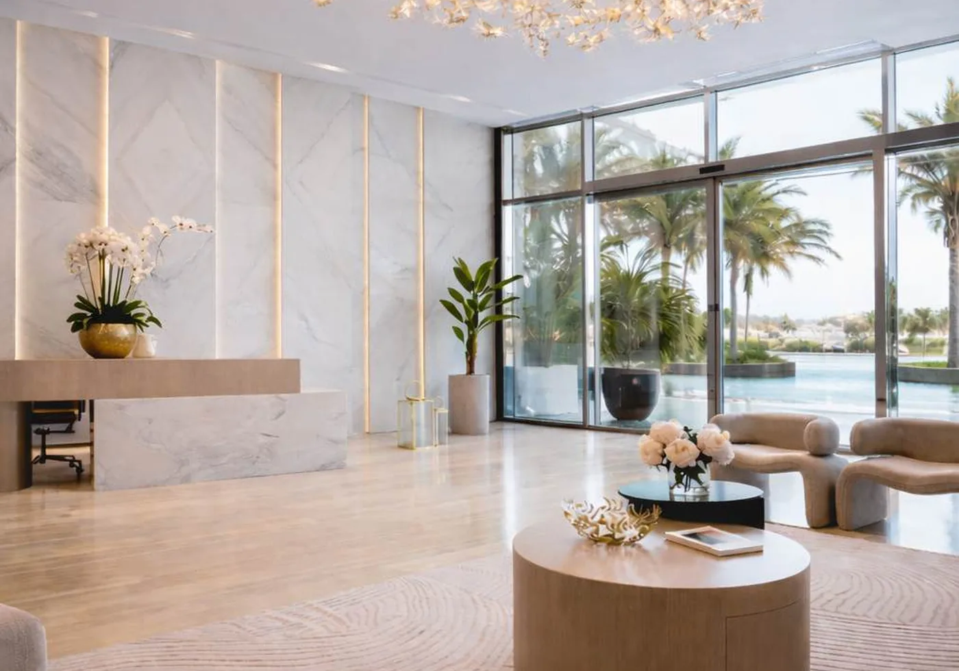 Bright reception interior with sculptural seating and a waterfront view