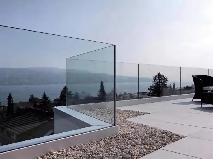 Frameless glass balustrade to a terrace overlooking open water