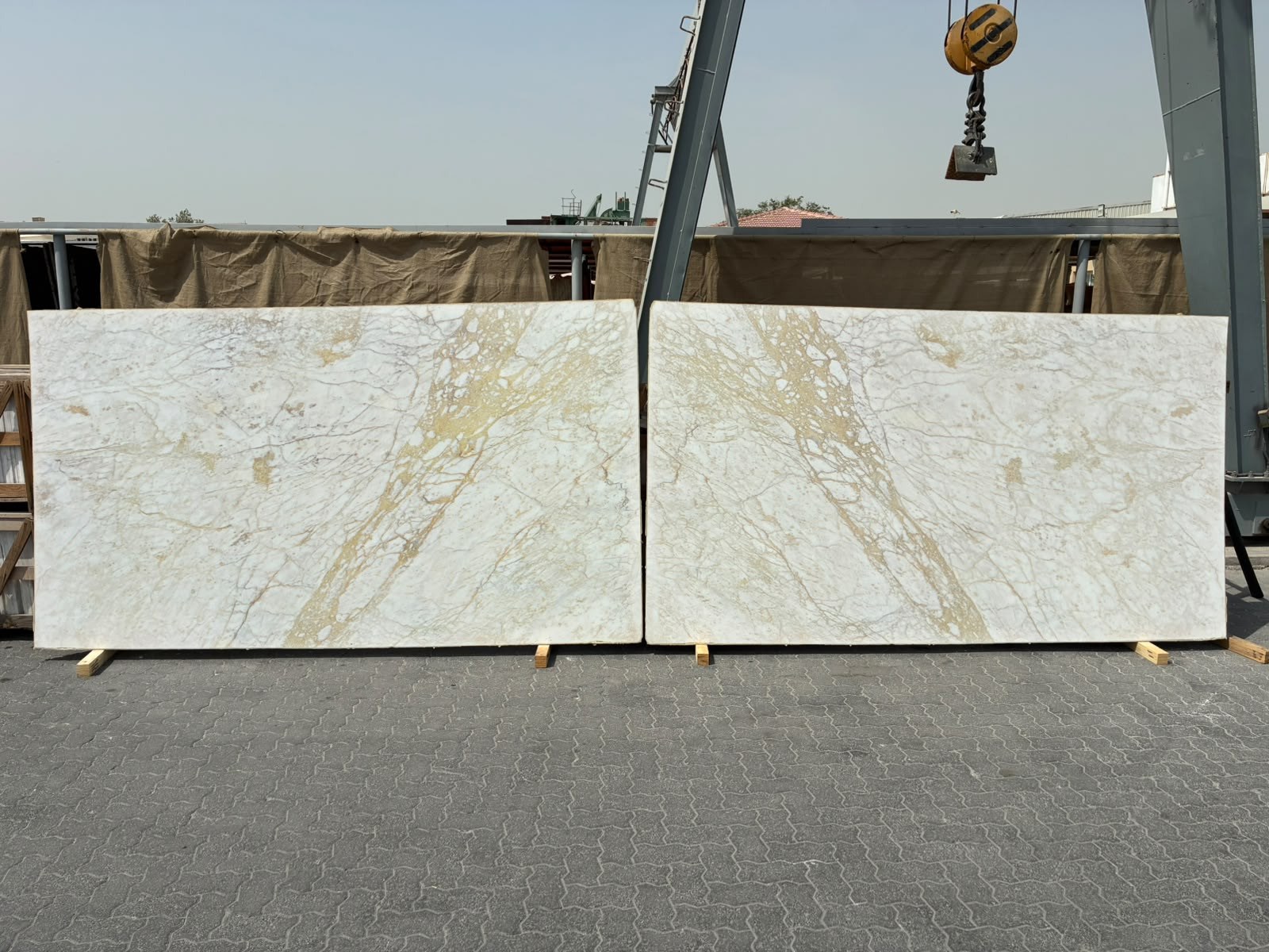 Reference image of two bookmatched marble slabs laid out for selection