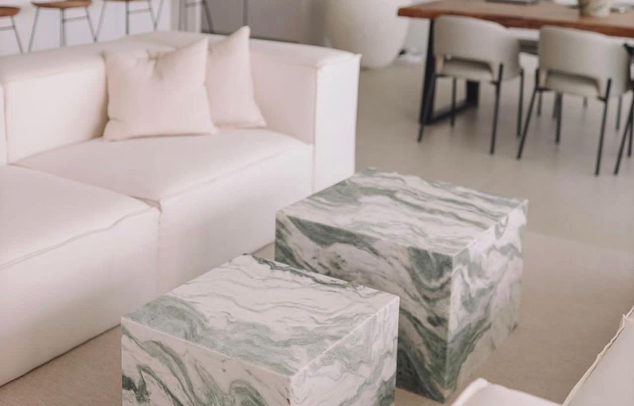 Pair of green and white stone cube tables (Source photo · piece / installation)