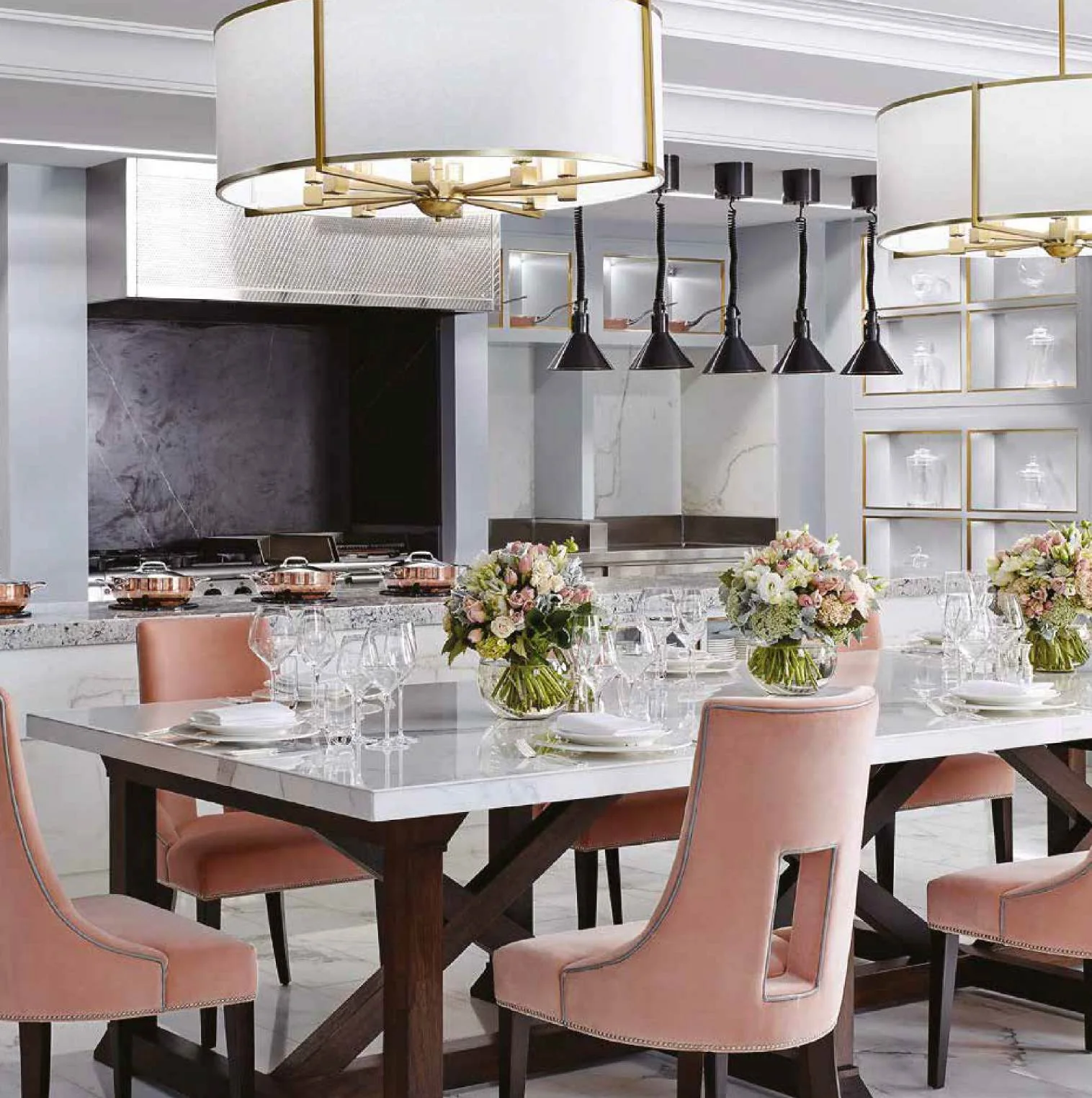 Hospitality dining room with upholstered chairs and pendant lighting