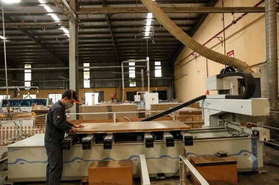 Operator working at a machining bench during production