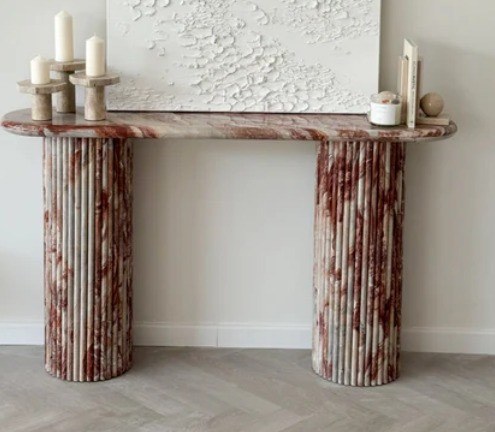 Reference image of a stone console on two fluted pedestals