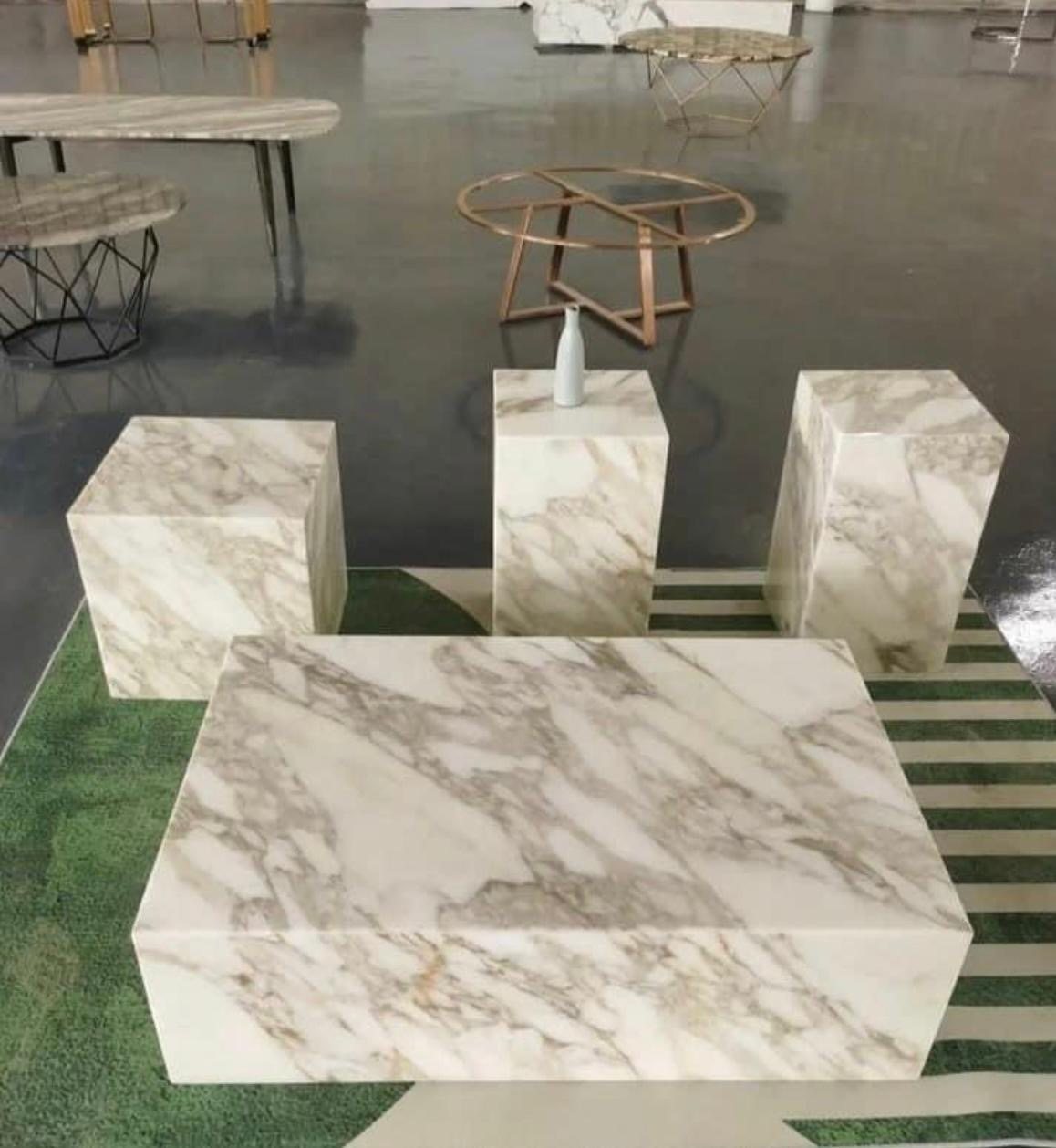White stone block tables in a matched set (Showroom)