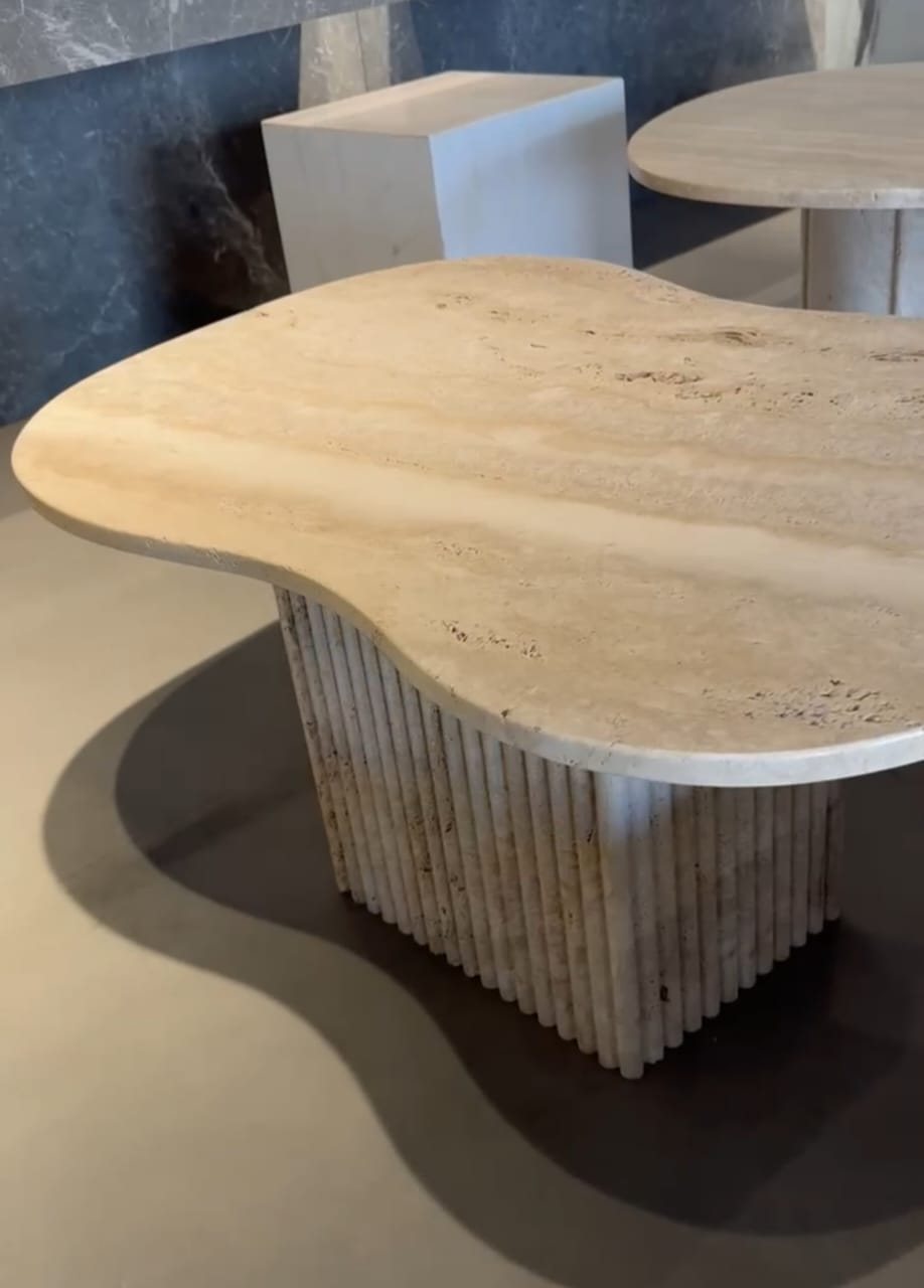 Freeform cream banded stone top on a fluted base (Showroom)