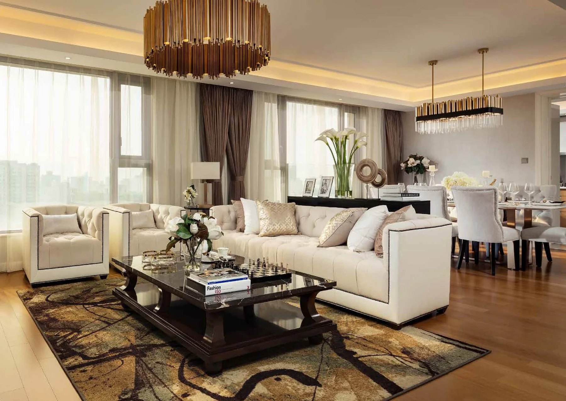 Classic living room with sofa, teal chairs, side tables and lamps