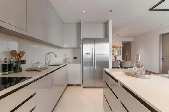 Kitchen with integrated appliances and handleless cabinet fronts