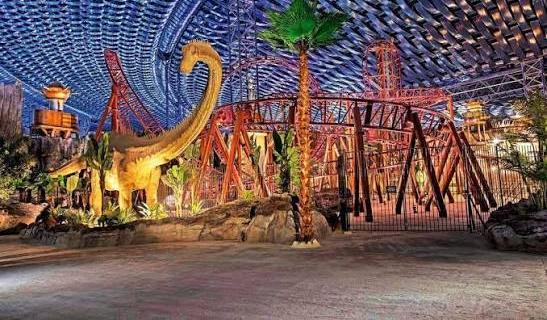 Themed rockwork and roller-coaster structure inside IMG Worlds of Adventure