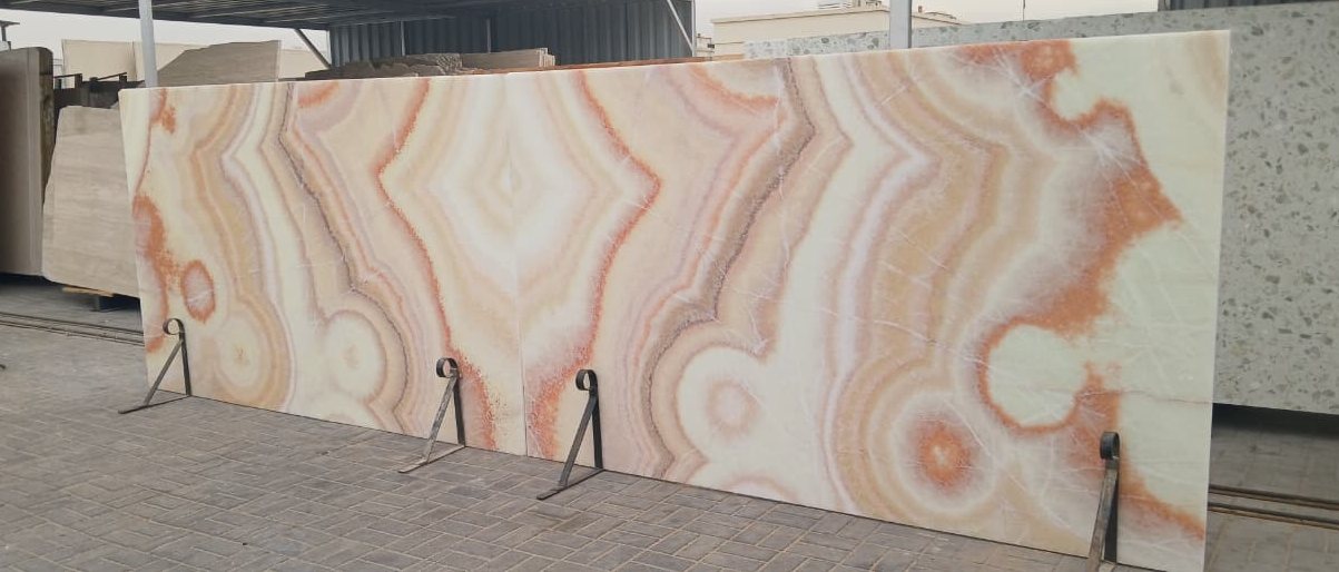 Banded translucent stone in amber, rose and cream