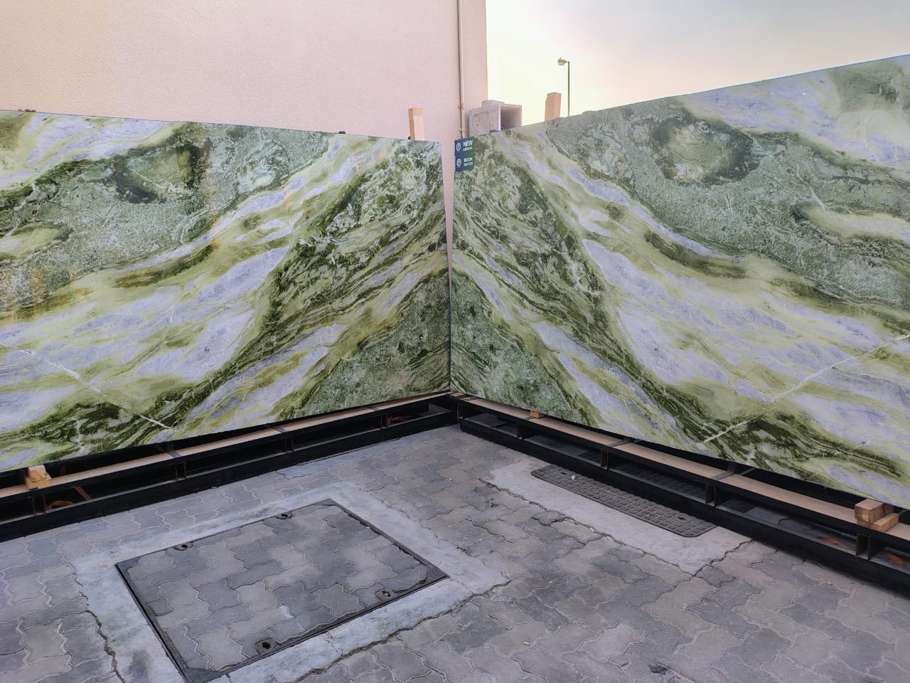 Bookmatched green slabs set out before fabrication