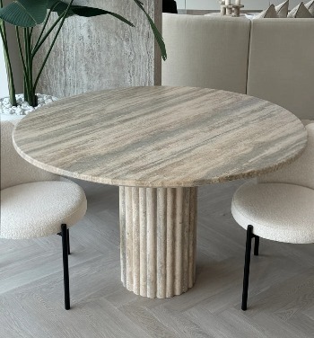 Reference image of a round travertine dining table on a fluted base