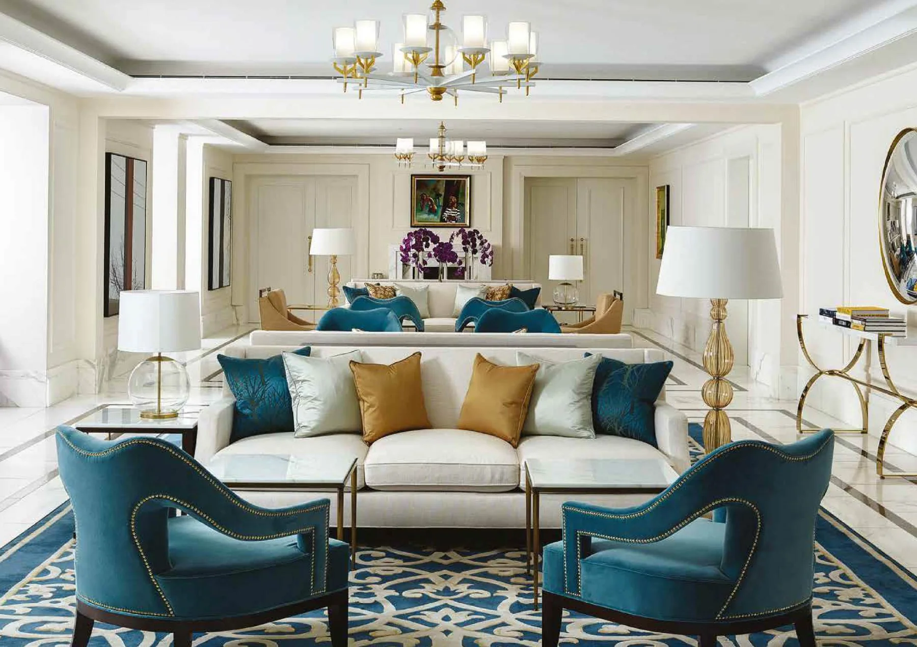 Complete living room with teal lounge chairs, sofa, tables and coordinated lighting