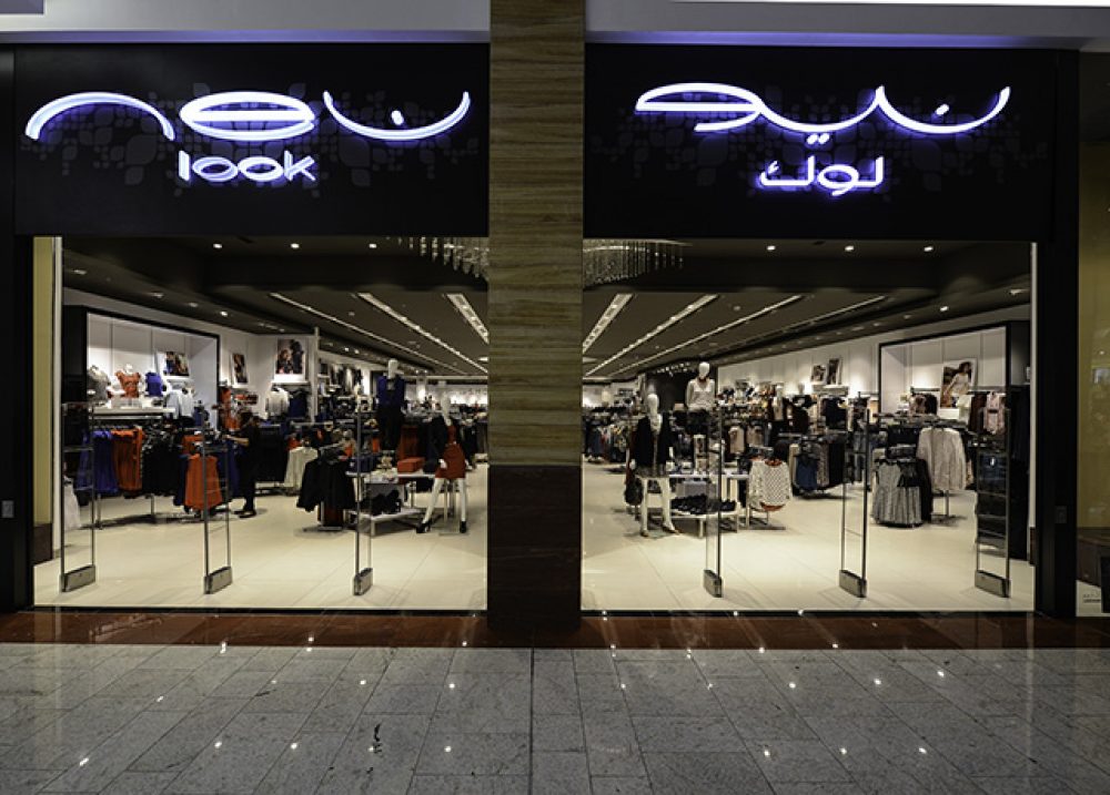 New Look store frontage in a Middle East mall with illuminated fascia, full-height glazing and fitted-out shop floor
