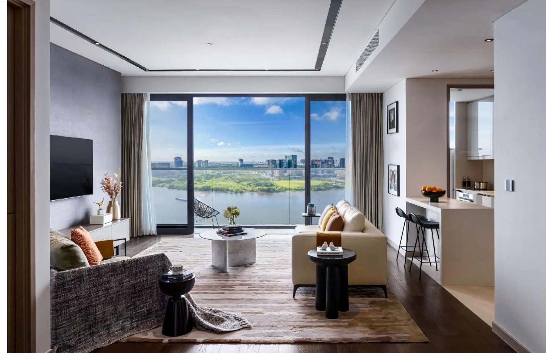 Branded residence interior in Ho Chi Minh City with marble, bespoke joinery and river views
