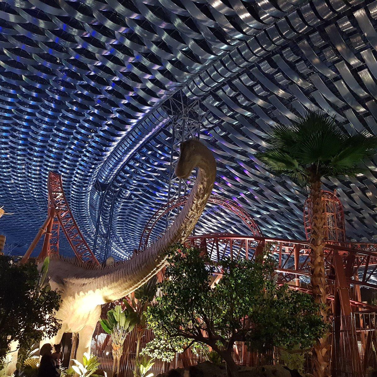 Interior of IMG Worlds of Adventure showing the domed roof structure above a themed ride zone