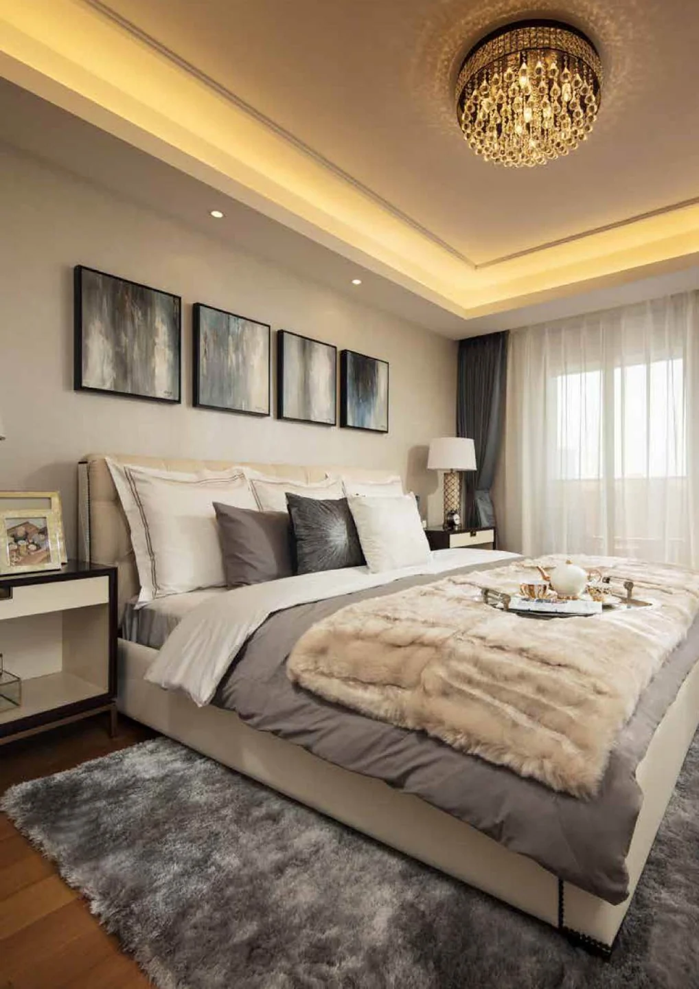 Upholstered bed with bedside furniture and coordinated wall finishes
