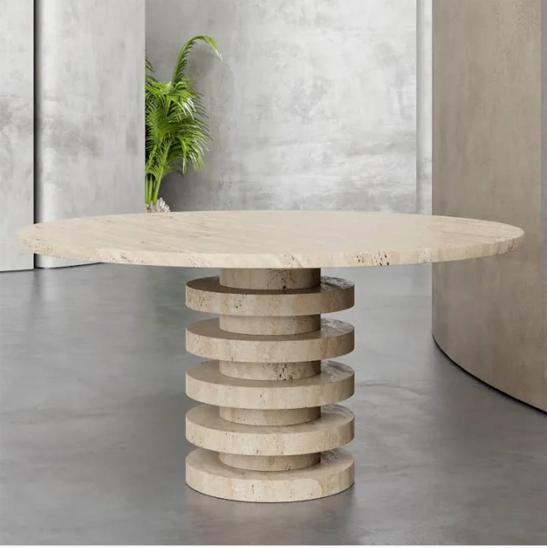 Cream banded stone table on a stacked disc base (Source photo · piece / installation)