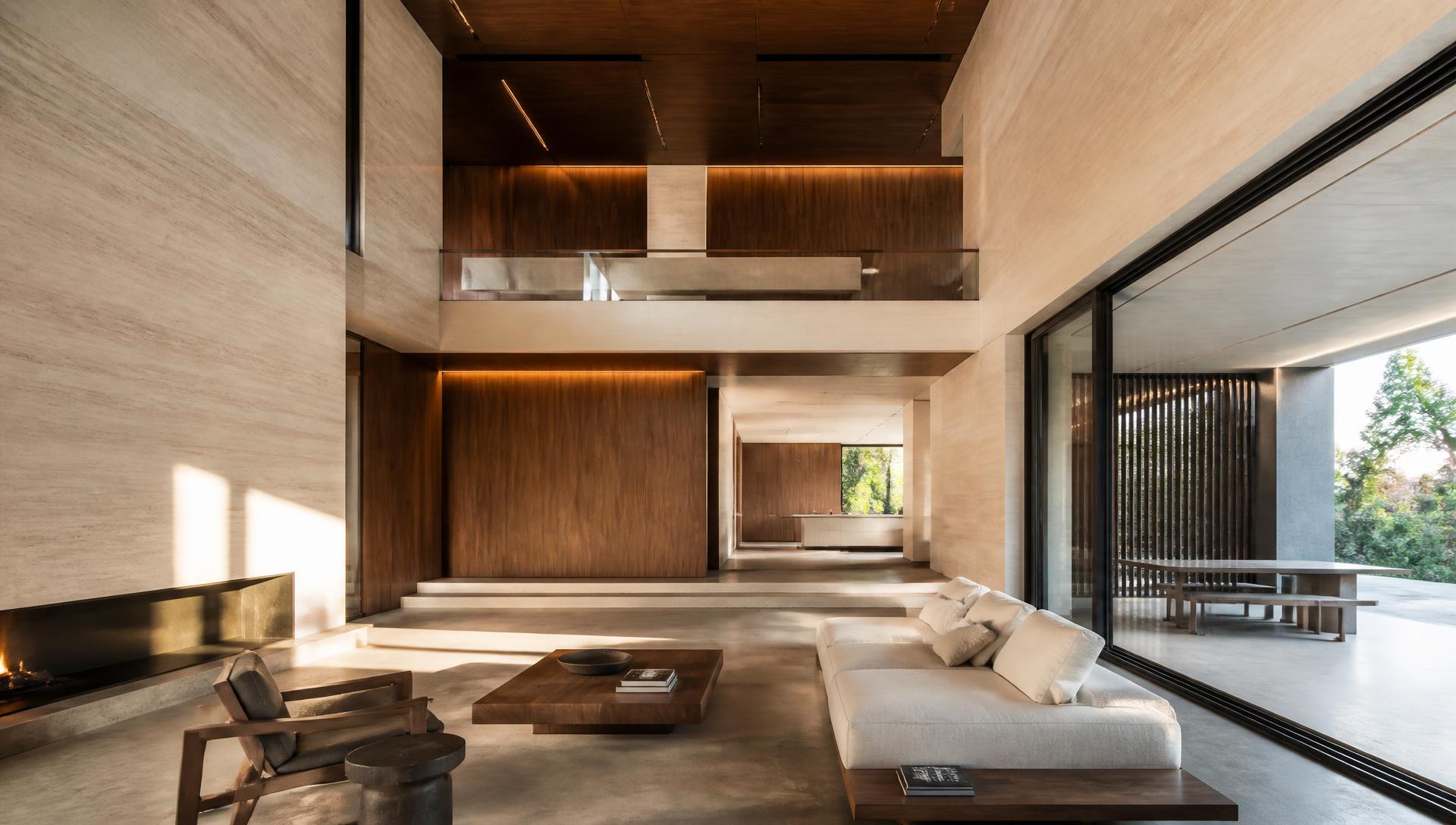 Completed private residence with stone walls, timber joinery and a double-height living volume